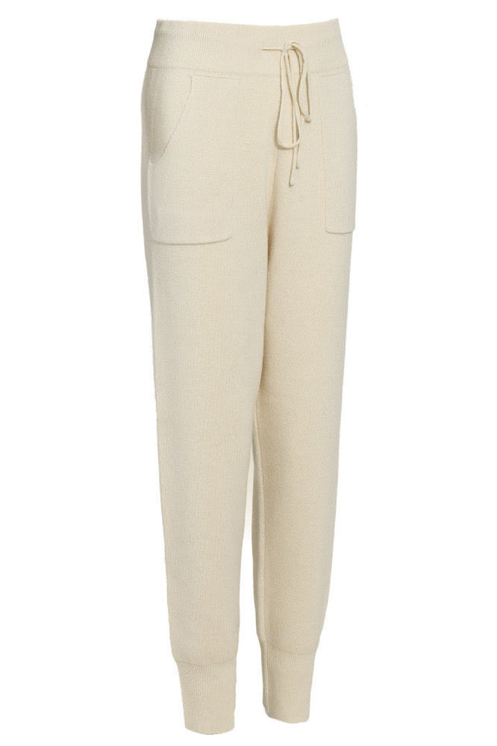 High-waisted cashmere lounge trousers with ribbed cuffs and a fluid drape, perfect for elevated casualwear in cooler seasons.