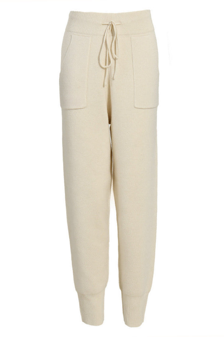 Soft cashmere blend knit pants with an elasticated waistband and relaxed leg, offering comfort and warmth for fall and winter days.