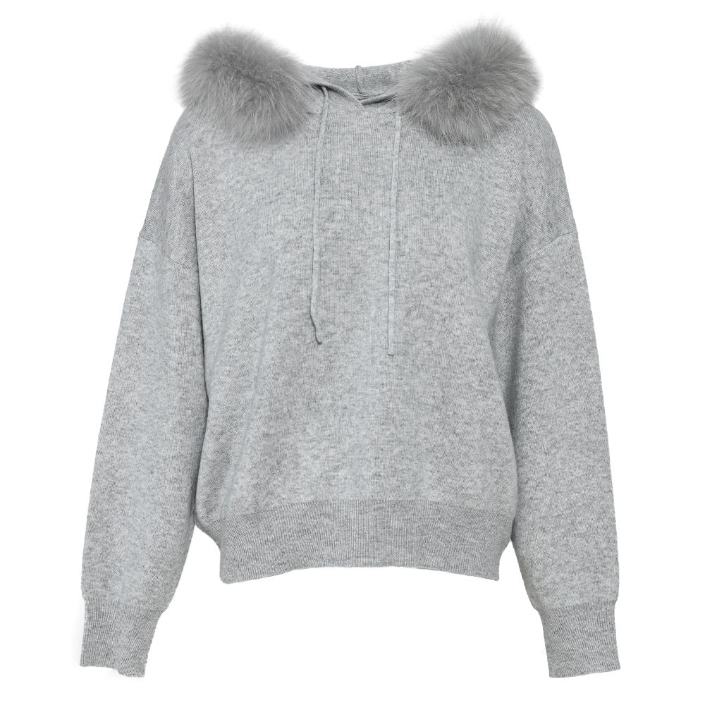 A luxurious cashmere wool set featuring a sweater with a soft fox fur trim and matching trousers. The set combines comfort and elegance, making it a cozy yet stylish option for cooler days.