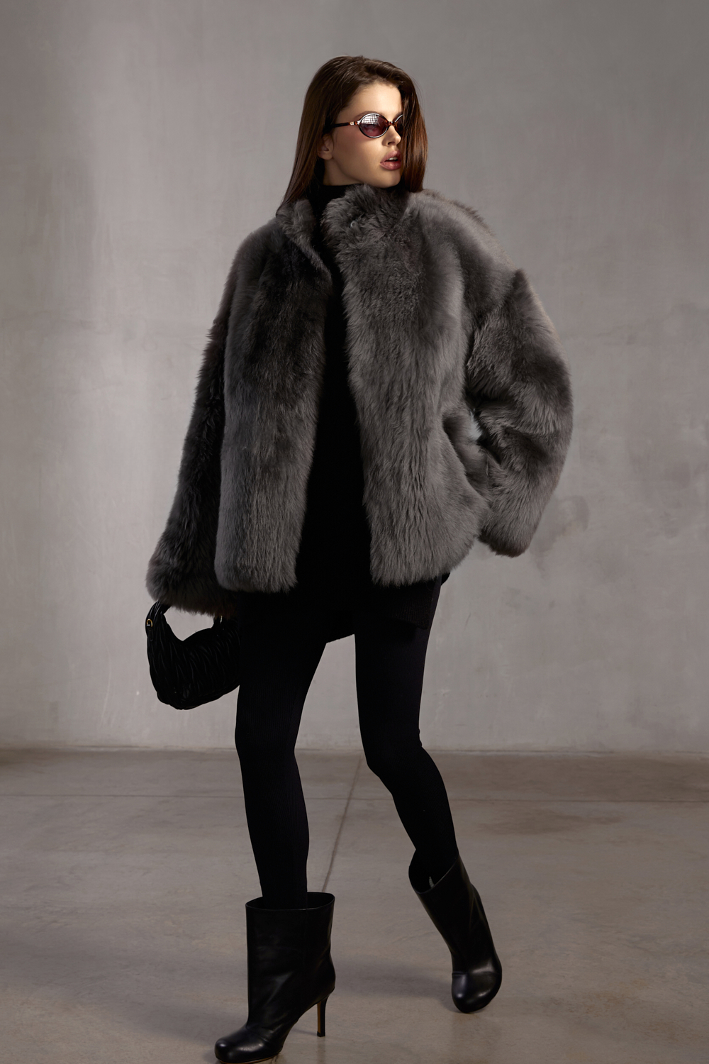 Woman wearing grey Tuscan shearling coat, showcasing premium winter elegance.