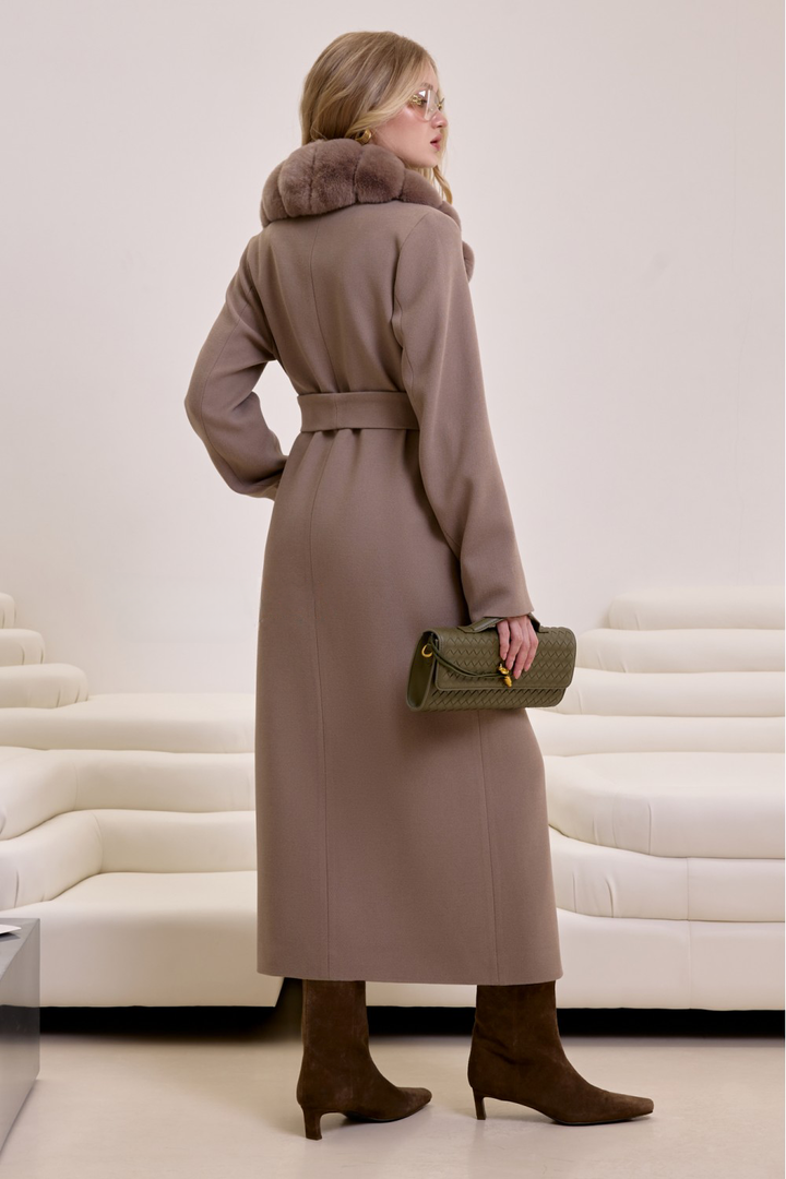 Chic taupe wool coat with cozy rex rabbit fur collar, worn by a woman for a polished winter look.