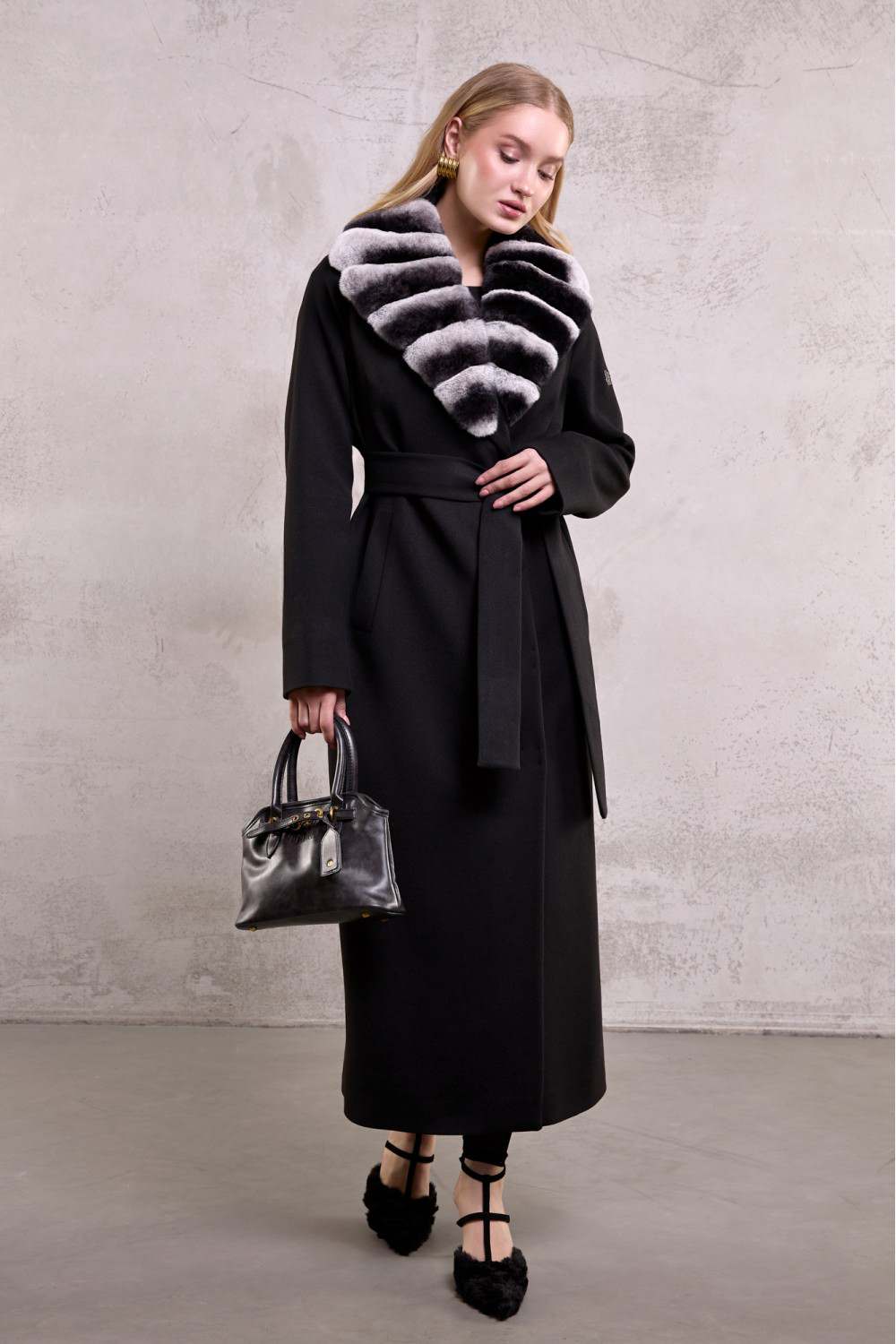 Sophisticated winter outfit featuring a black wool coat accented with ultra-soft chinchilla-toned rex rabbit fur.