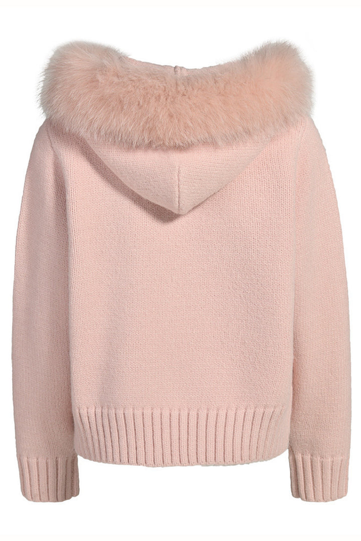Soft pink cashmere jacket with coordinating fox fur, offering a refined and romantic loungewear look.