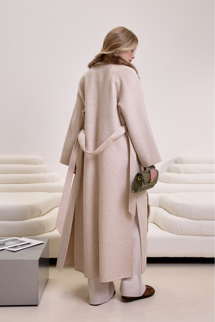 Model showcasing a timeless cashmere and mink fur coat, ideal for luxury outerwear collections.