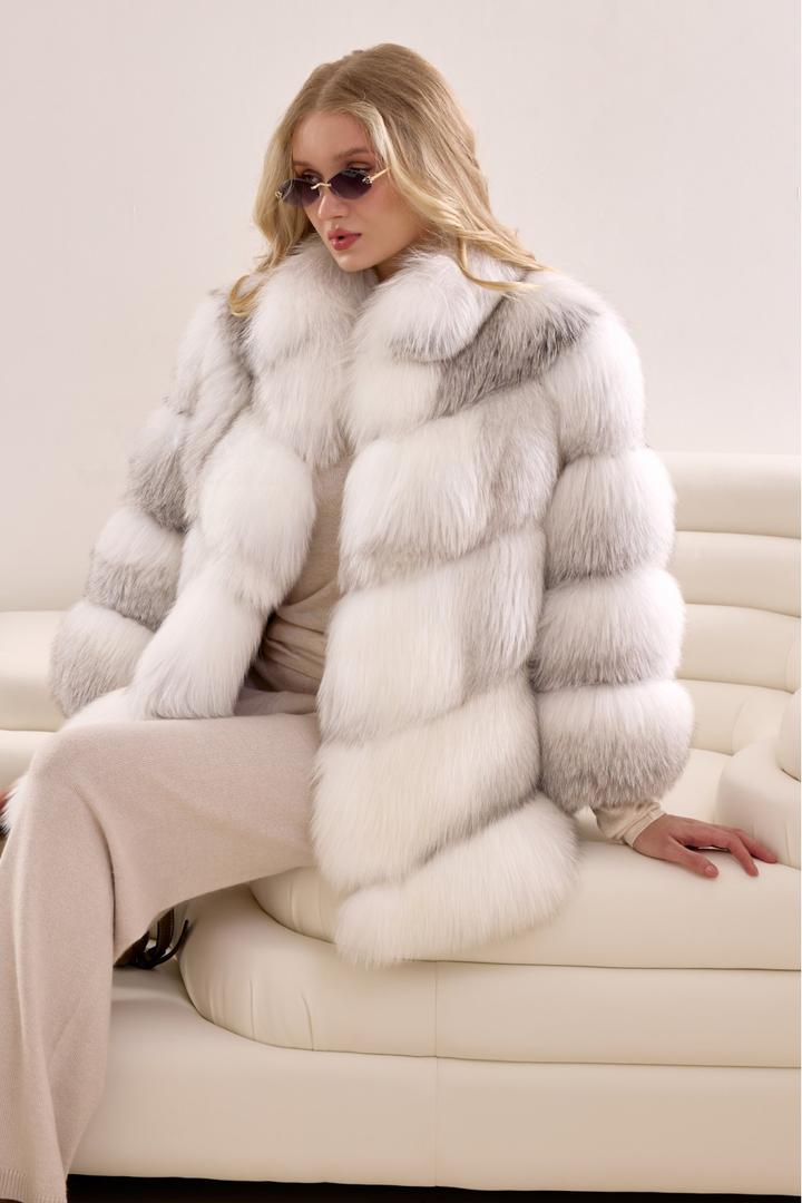 Model wrapped in a statement Arctic Crossed fox fur coat, tailored for warmth, sophistication, and bold luxury.