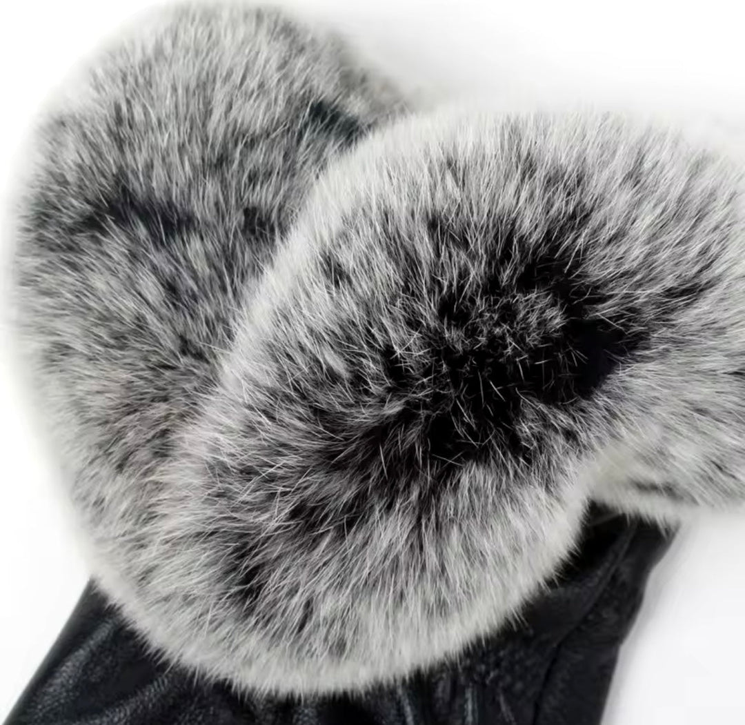 High-quality leather gloves featuring plush fox fur trim, combining style and cozy comfort.