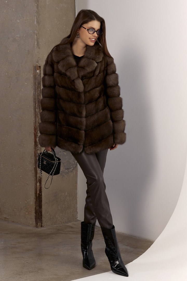 Elegant short brown sable coat styled for chic cold-weather fashion.