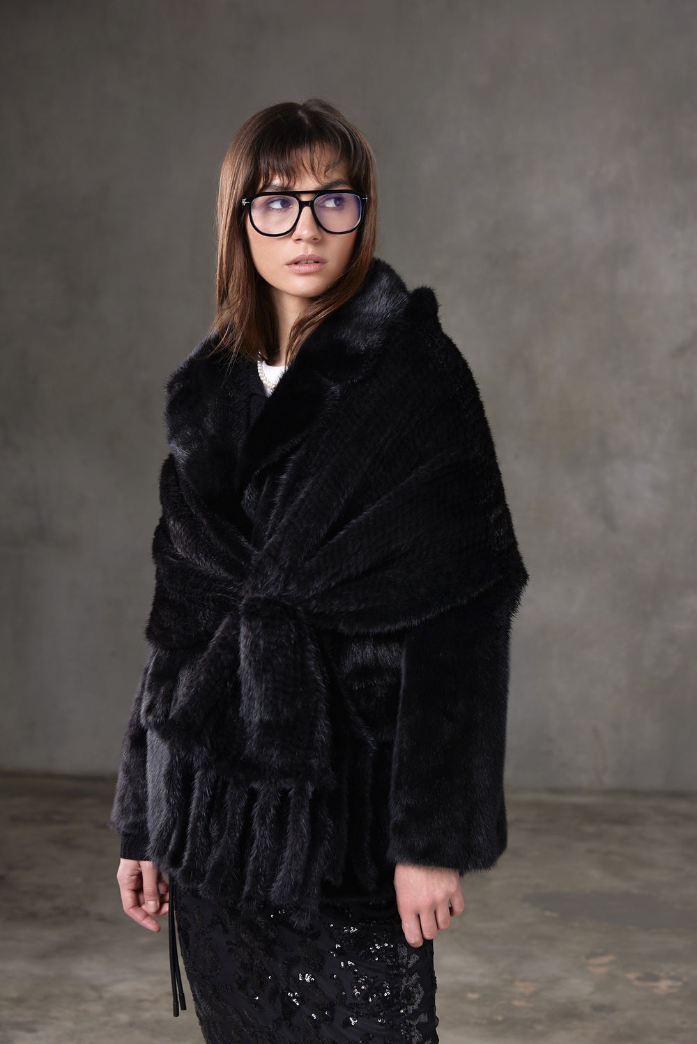 Soft and voluminous black mink fur scarf, designed to provide cozy warmth while elevating a chic, polished look.