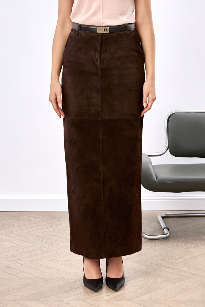 A woman wearing a luxurious brown suede pencil skirt with a high waist and sleek silhouette, exuding effortless elegance and timeless style.