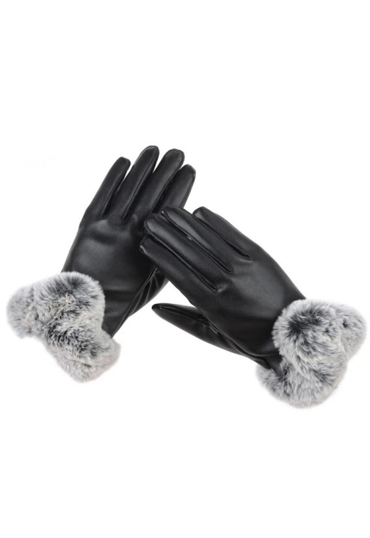 A pair of genuine leather gloves lined with soft, luxurious fox fur for added warmth and elegance.