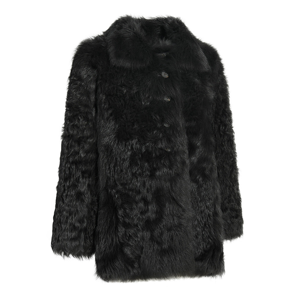 Luxurious black shearling coat featuring rich natural texture, designed to provide cozy comfort and timeless elegance for plus-size silhouettes.