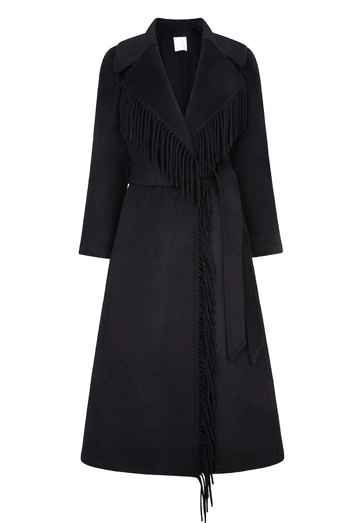 a chic black fringe cashmere coat with a plush black fox fur collar. The coat’s stylish design and soft textures create a striking and elegant look for colder days.