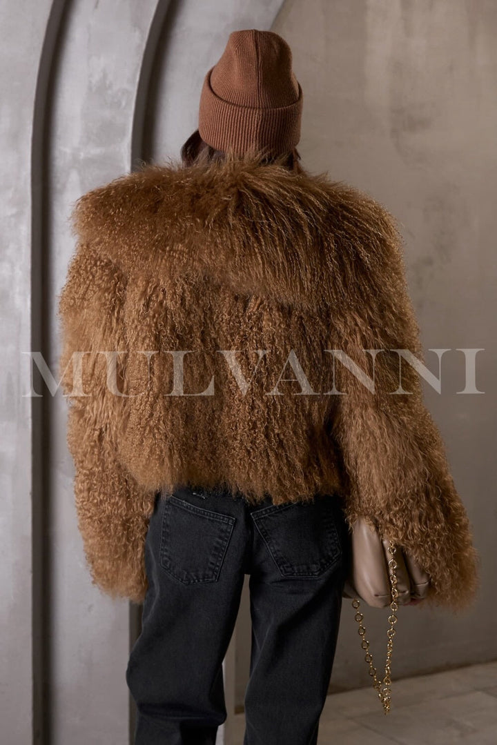 The luxurious brown short Mongolian fur coat complements the woman's outfit, featuring a soft, eye-catching texture that adds flair to her look.