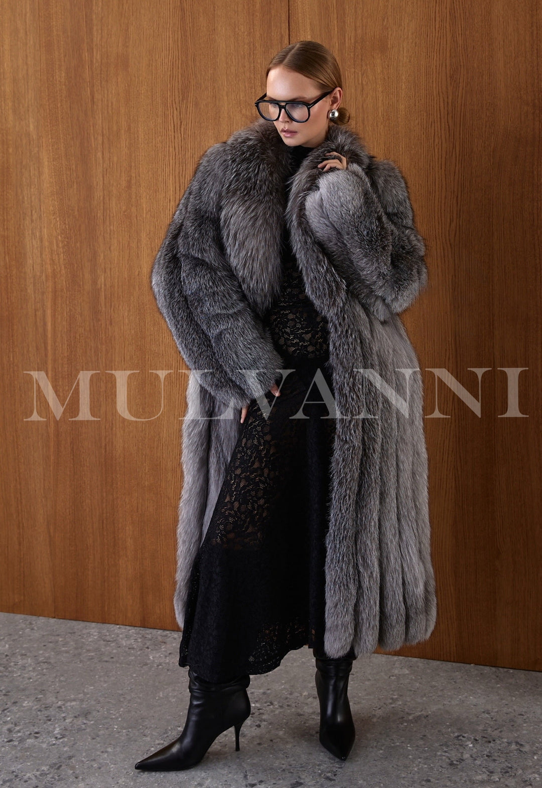 This luxurious Silver Frost Fox Fur coat is a true statement of elegance, crafted from the finest natural fox fur. Its soft, dense texture and rich tonal variation offer both warmth and sophistication. The 130 cm length adds dramatic flair while maintaini