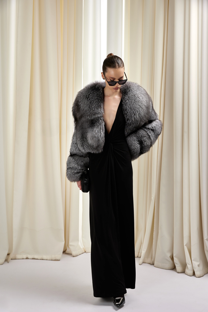 Woman wearing a Silver fox fur outerwear by MULVANNI — short, sophisticated, and statement-making.