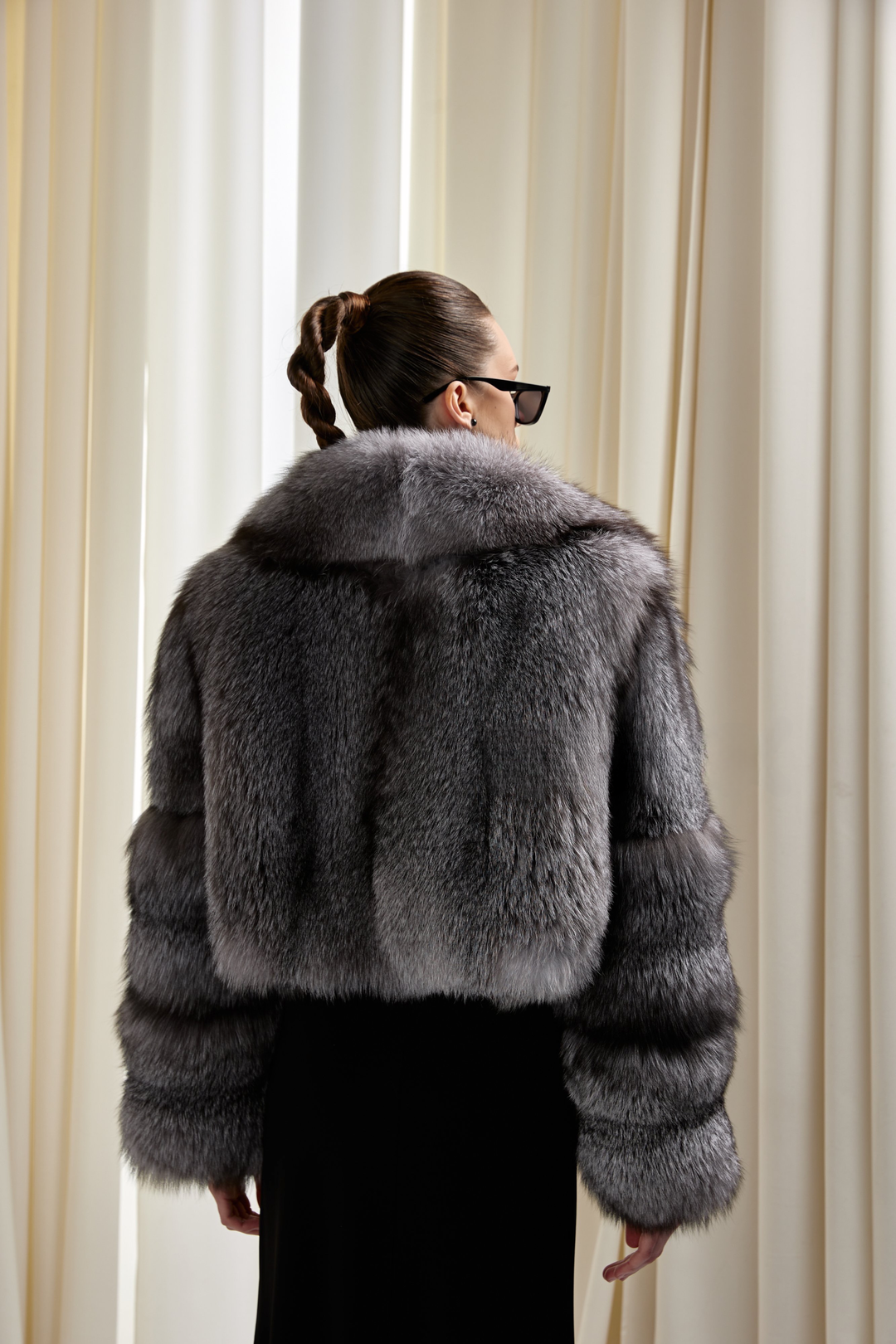 Back of a Luxurious cropped silver fox coat highlighting timeless elegance and modern glamour.