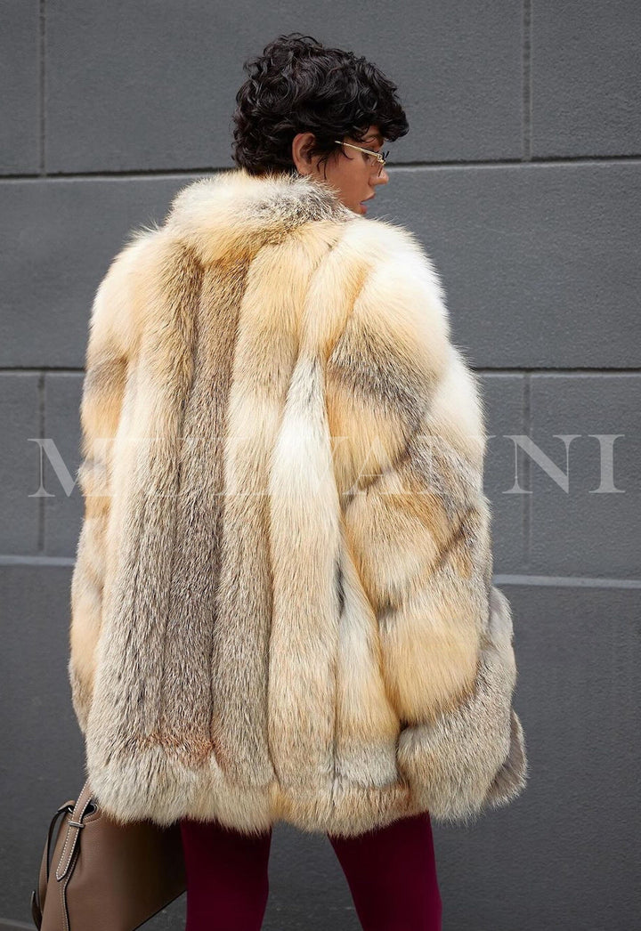 Luxurious high quality genuine gold fox fur coat for woman with classic silhouette and opulent warmth, showcasing plush, radiant fur.