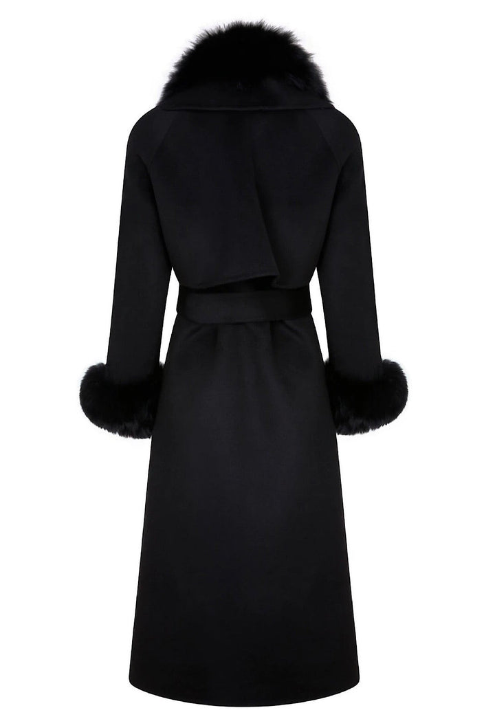 A fashionable black fringe cashmere coat adorned with a soft black fox fur collar. The combination of fringe and fur elevates the coat's elegance, making it perfect for sophisticated winter wear.