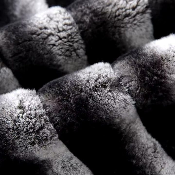 Close up of genuine Rex Rabbit fur, designed with a detachable lining for easy maintenance and insulation.