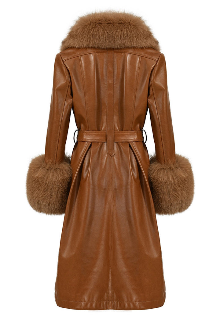 Elegant and long brown leather trench coat with fox fur trim, designed for women who appreciate high-quality, designer outerwear.