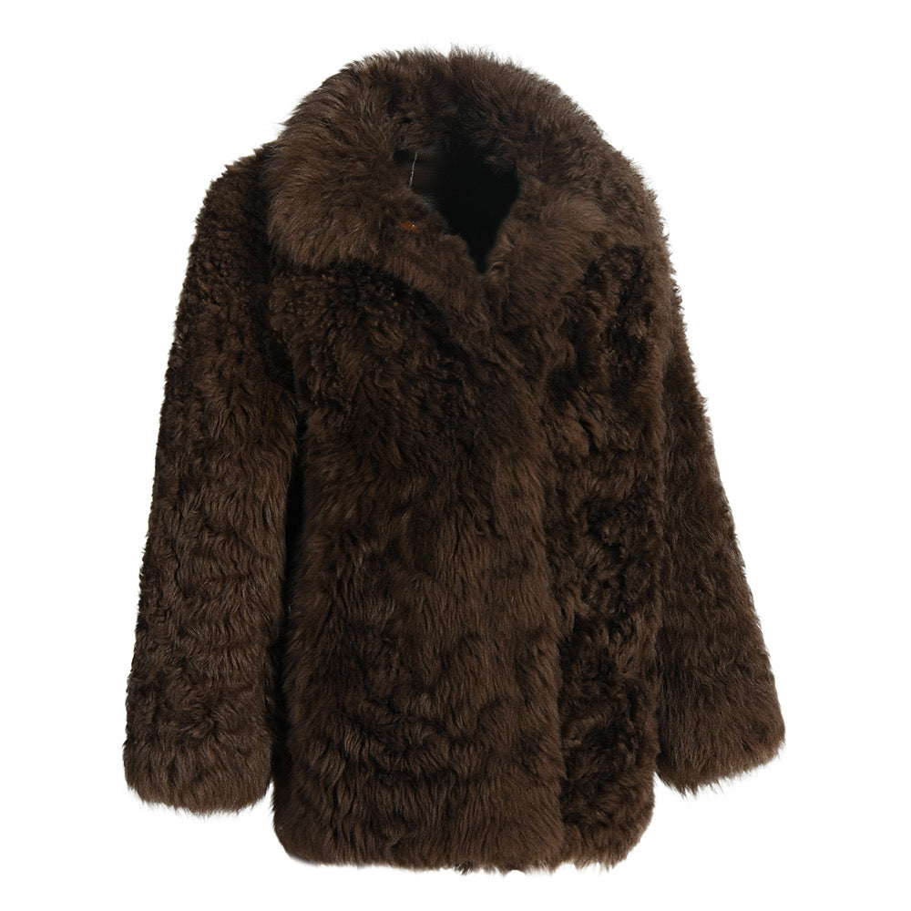 Luxurious brown shearling coat featuring rich texture and thick fabric, blending classic style with cozy comfort.
