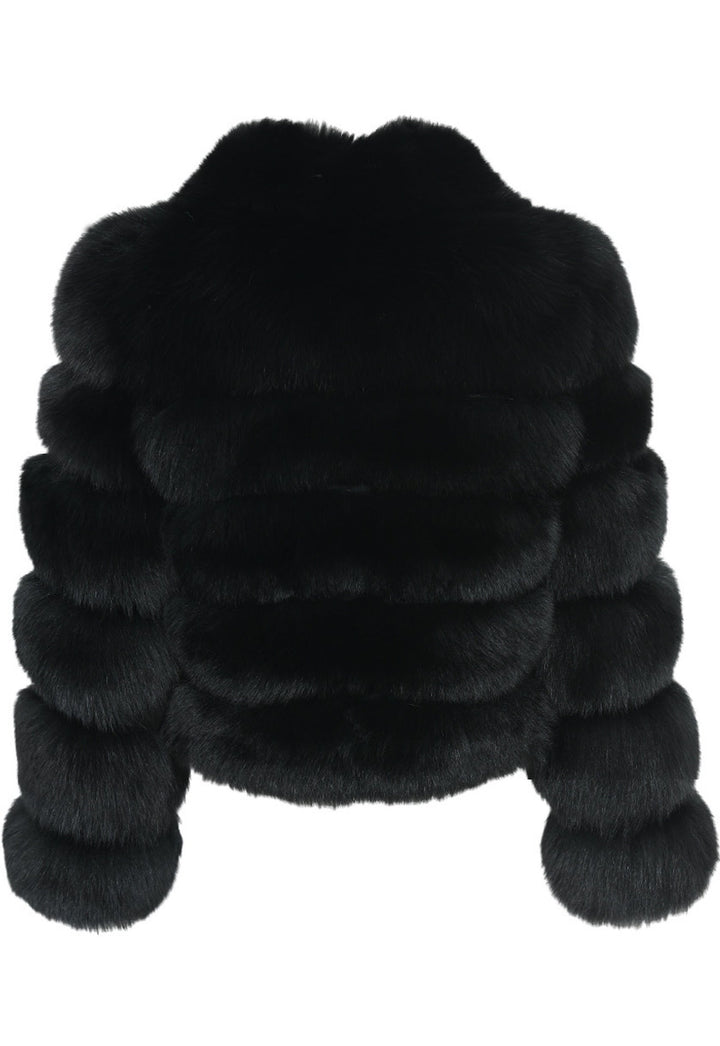 Elegant Italian-designed black fur coat for women, made from superior Saga Furs, offering unmatched quality and refined style.