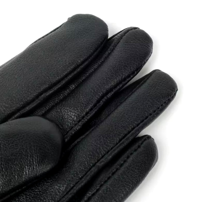 Elegant leather gloves with fox fur lining, offering both refined style and exceptional warmth.