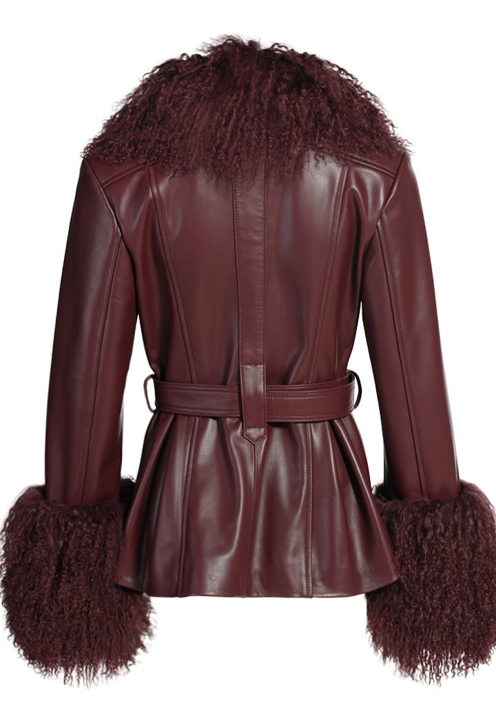 Short trench jacket in burgundy lambskin leather with luxurious Mongolian fur collar and cuffs, complete with leather buttons and a defining waist belt.
