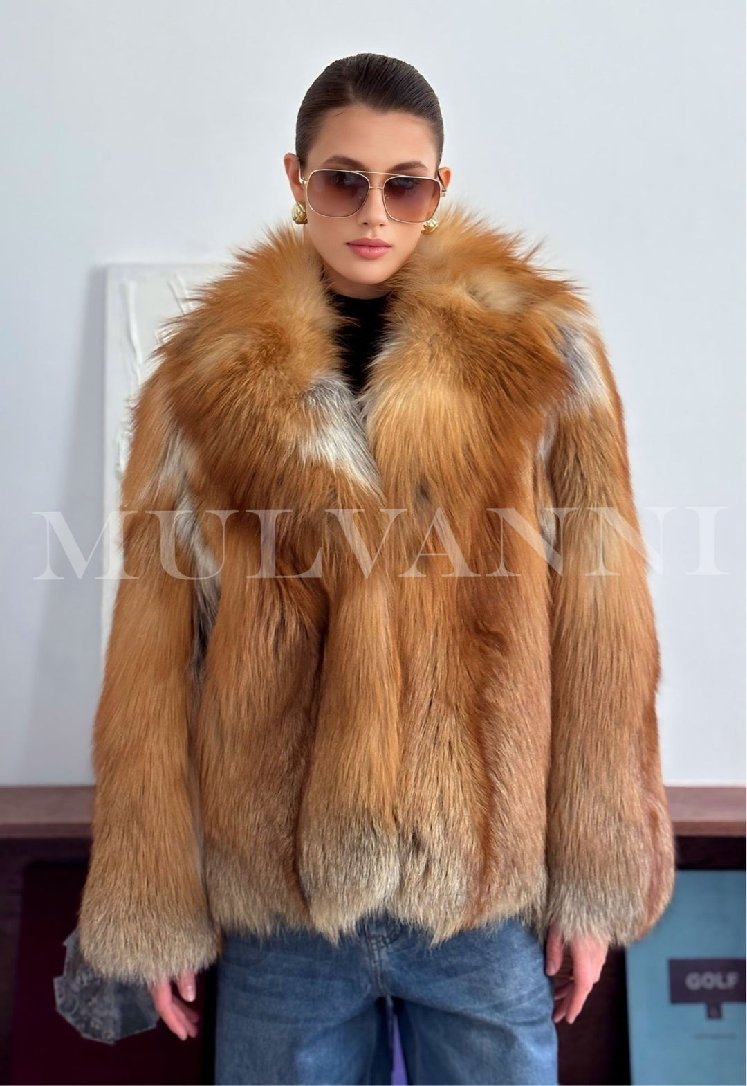 A woman wearing a luxurious red fox fur coat, featuring rich fiery hues and voluminous fur that provides exceptional warmth for harsh winter days.