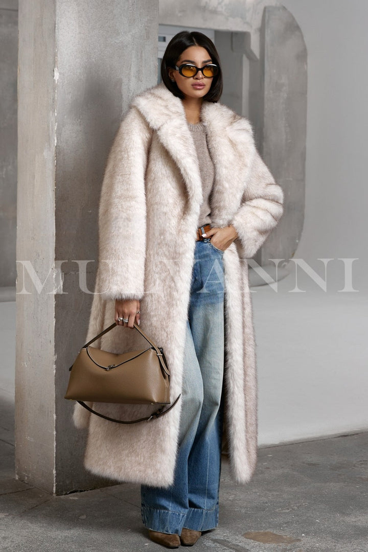 Casually styled woman in a plush faux fur coat, featuring a fluffy texture and loose silhouette ideal for laid-back winter days.