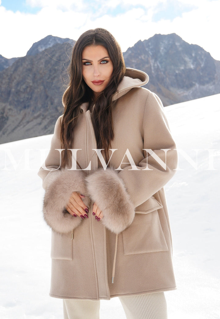 Woman wearing a Reversible Merino Wool Parka and Fox Fur Vest, luxury designer coat for extreme weather, limited edition.