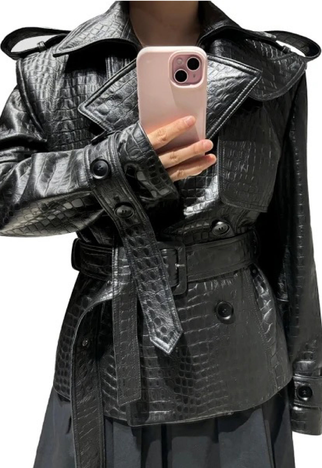 A woman wearing a croc- leather embossed jacket. Fashionable and high quality design. 