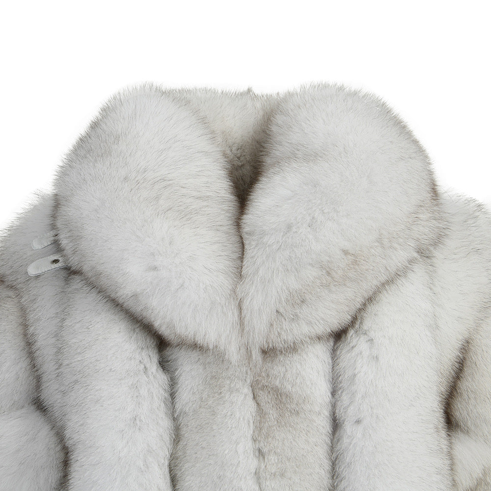 A chic natural white fox fur coat featuring a large, eye-catching collar, designed to elevate any winter wardrobe with its luxurious appeal