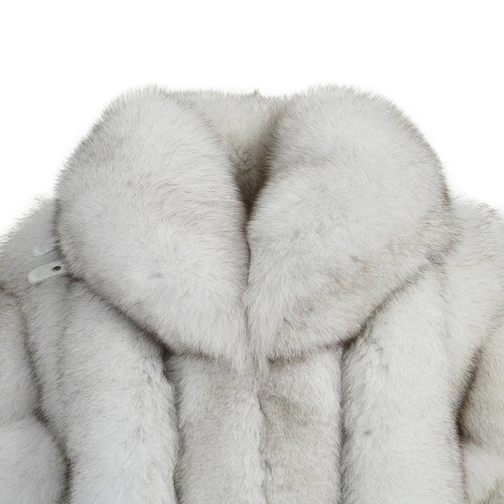 A chic natural white fox fur coat featuring a large, eye-catching collar, designed to elevate any winter wardrobe with its luxurious appeal