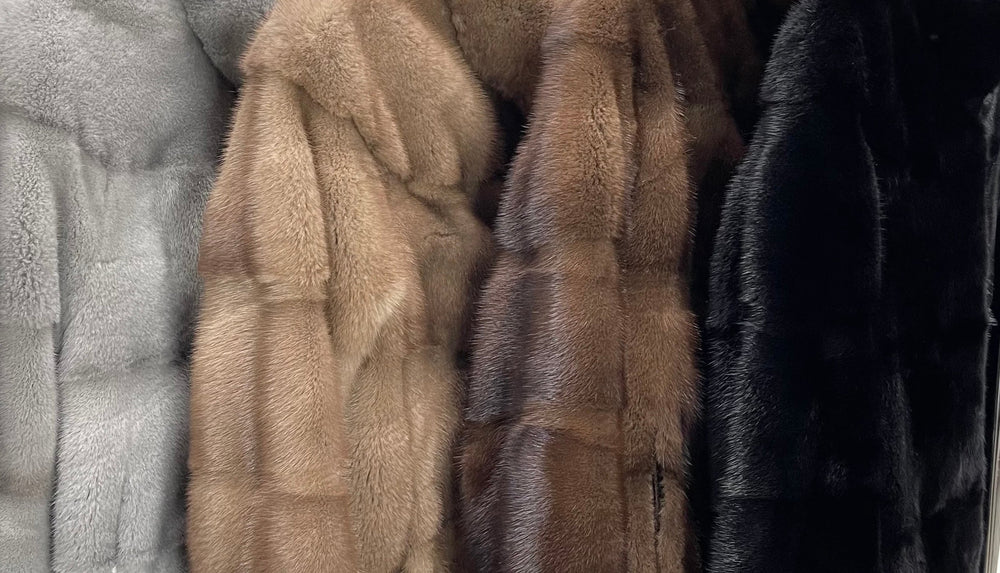Diverse range of luxurious mink fur coats in grey, brown, and black, showcasing plush textures and high-end fashion design.
