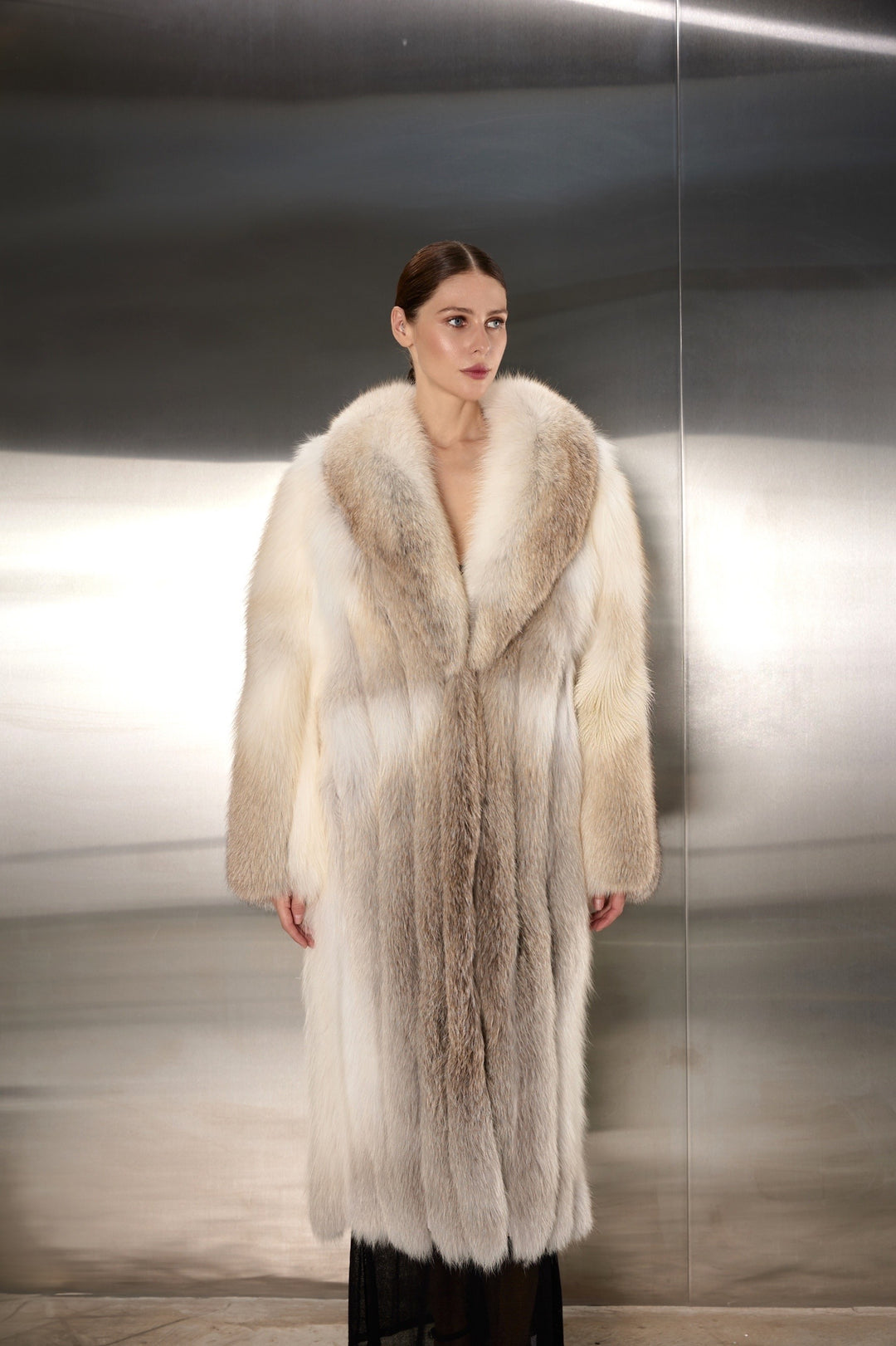 Woman elegantly styled in a gold fox fur coat, featuring dense, radiant fur and a sleek design that blends supreme comfort with high-end fashion for the cold season.