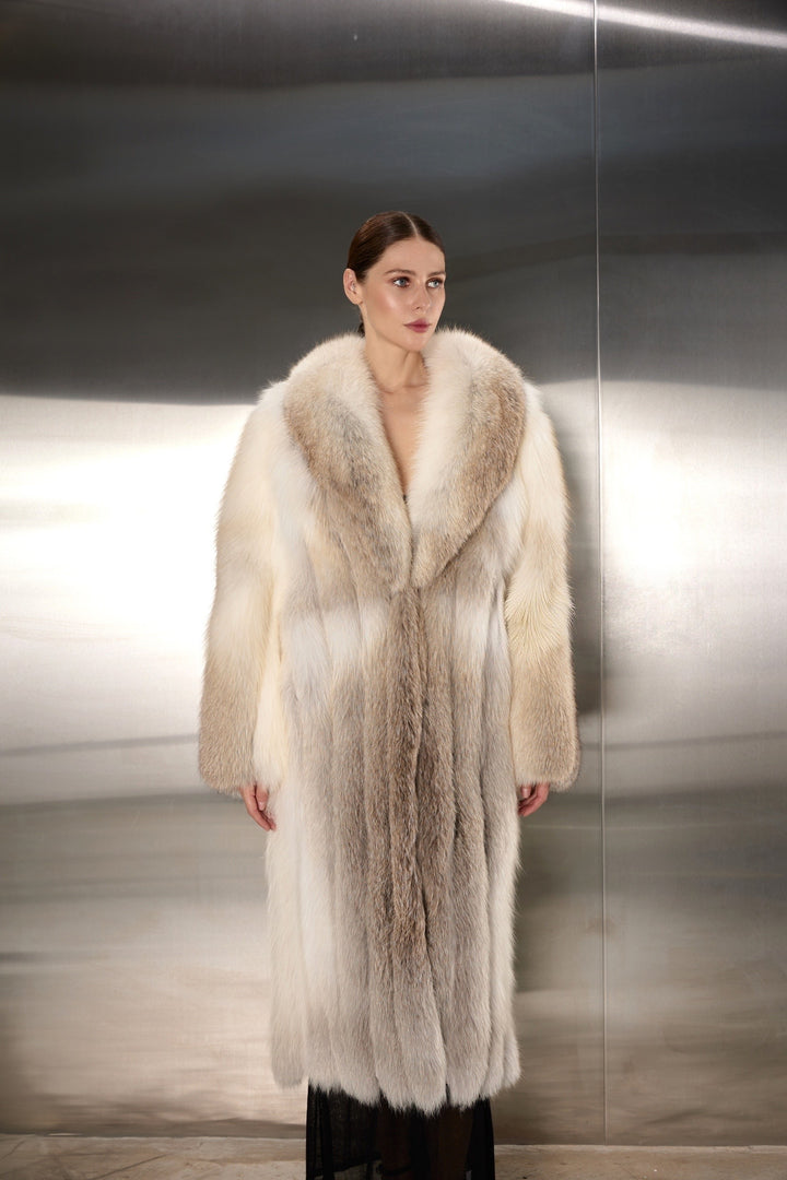 Woman elegantly styled in a gold fox fur coat, featuring dense, radiant fur and a sleek design that blends supreme comfort with high-end fashion for the cold season.