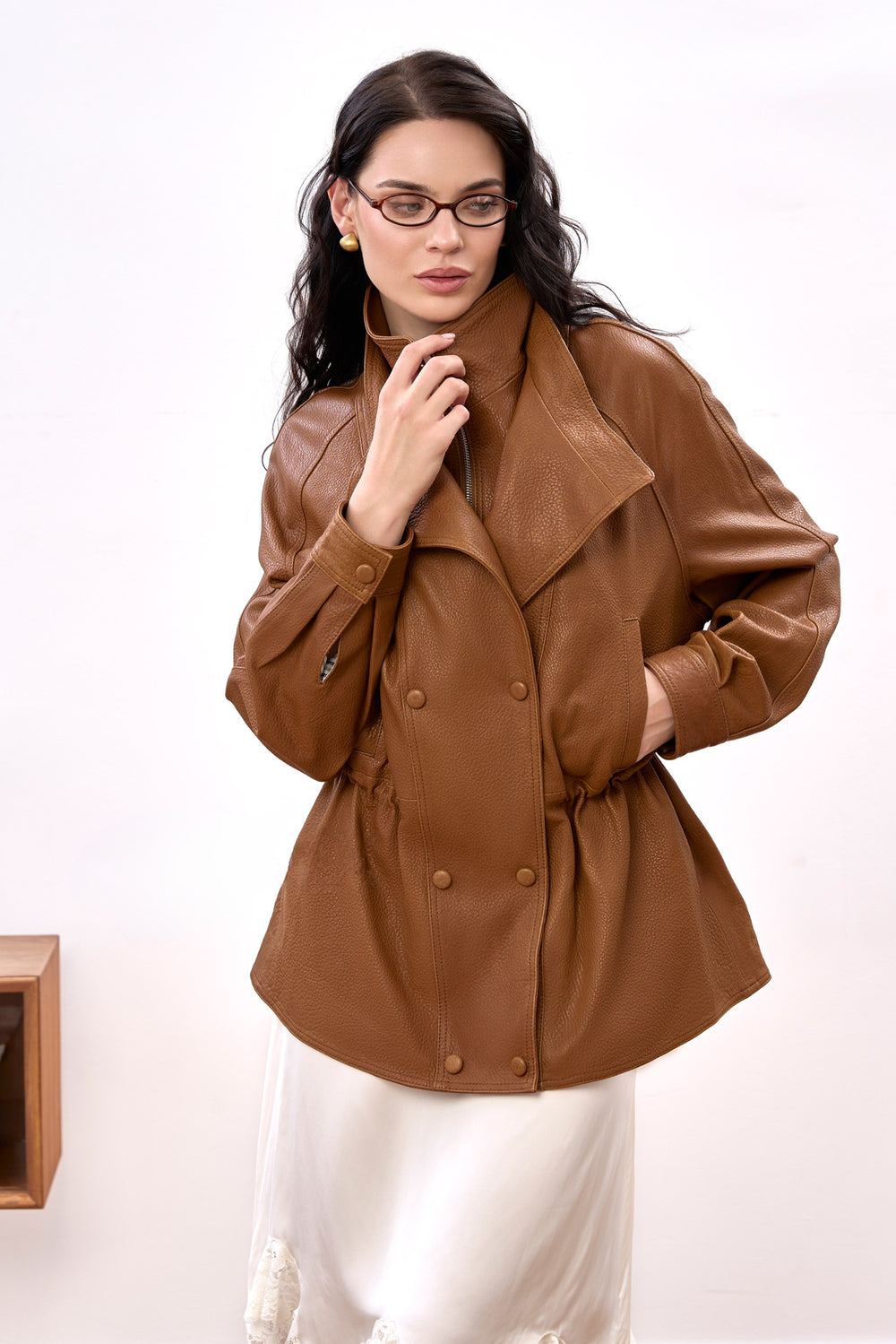 Elegantly dressed, a woman models the Simona Genuine Leather Jacket, featuring rich suede texture and a comfortable, refined silhouette.