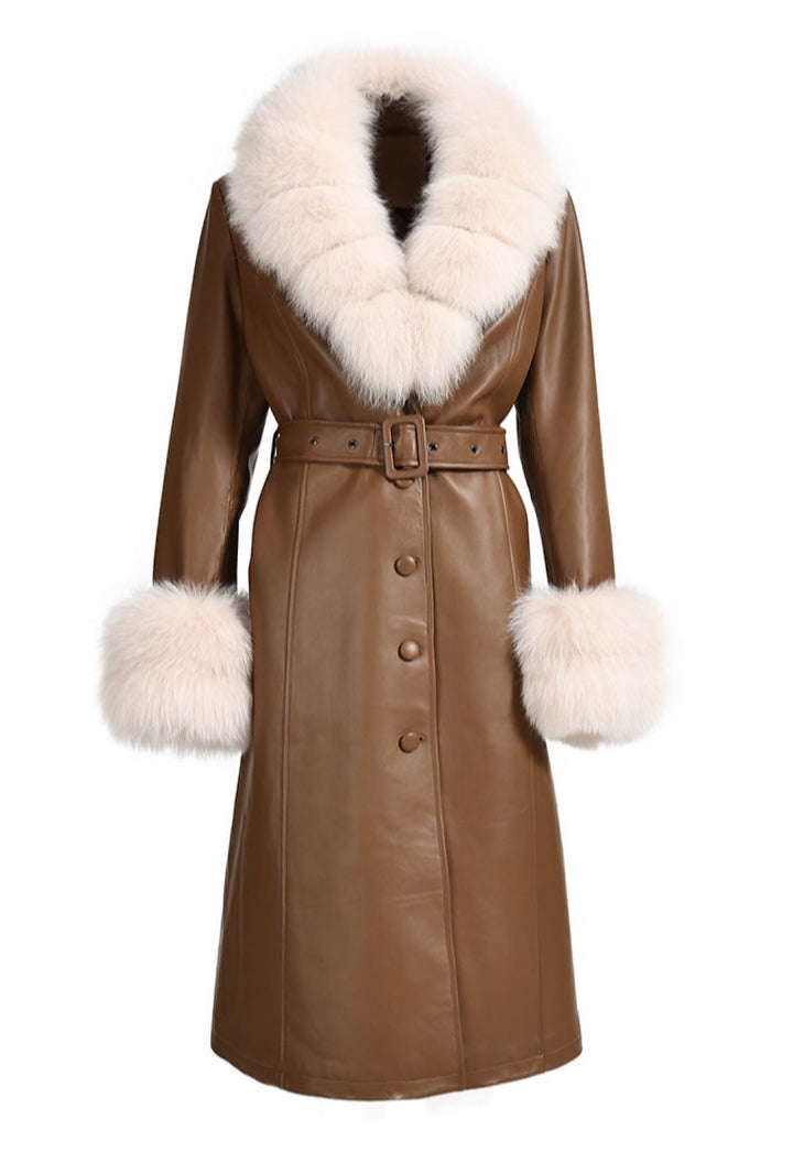 A brown leather trench coat adorned with luxurious beige fox fur accents. The coat's sleek design and fur detailing create a stylish and sophisticated look for winter.