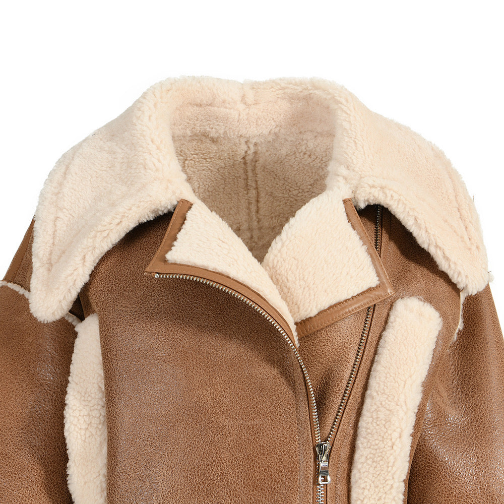 A stylish cropped brown shearling leather jacket, showcasing a balance of comfort and edgy sophistication.