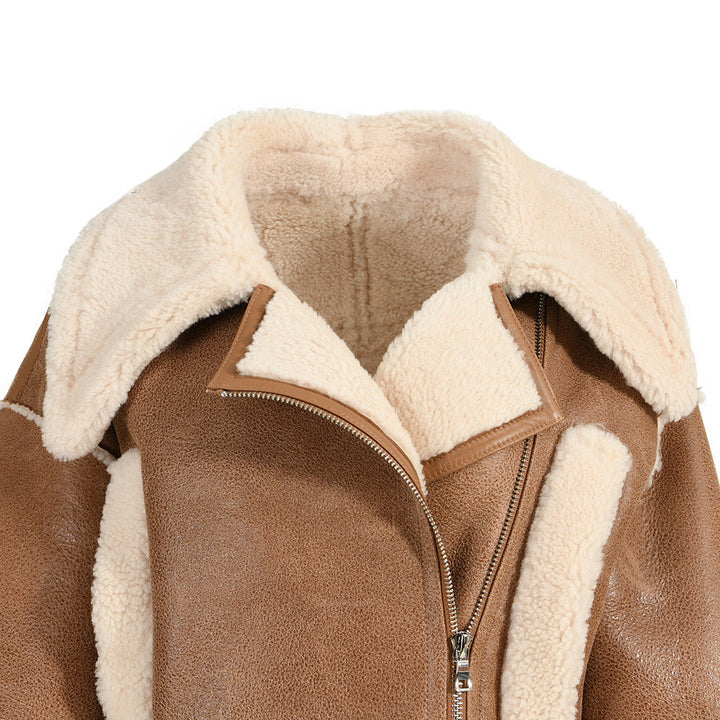 A stylish cropped brown shearling leather jacket, showcasing a balance of comfort and edgy sophistication.