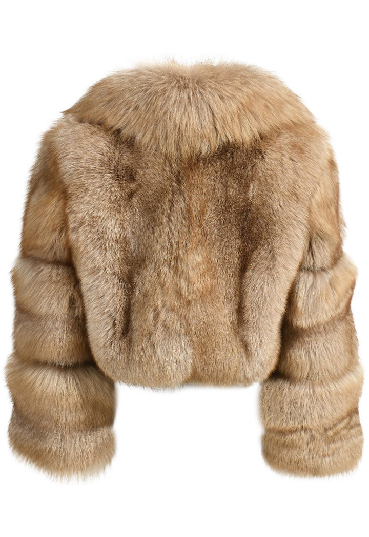 This chic cropped fox fur coat has a voluminous fur collar, combining warmth and elegance for a fashionable statement.