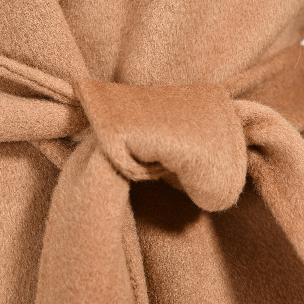 Close up from a camel cashmere coat for woman. 