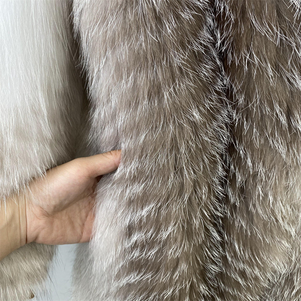 Sumptuous long coat crafted from 100% Arctic Crossed Marble Fox Fur, combining rare fur with soft satin for ultimate comfort and style.