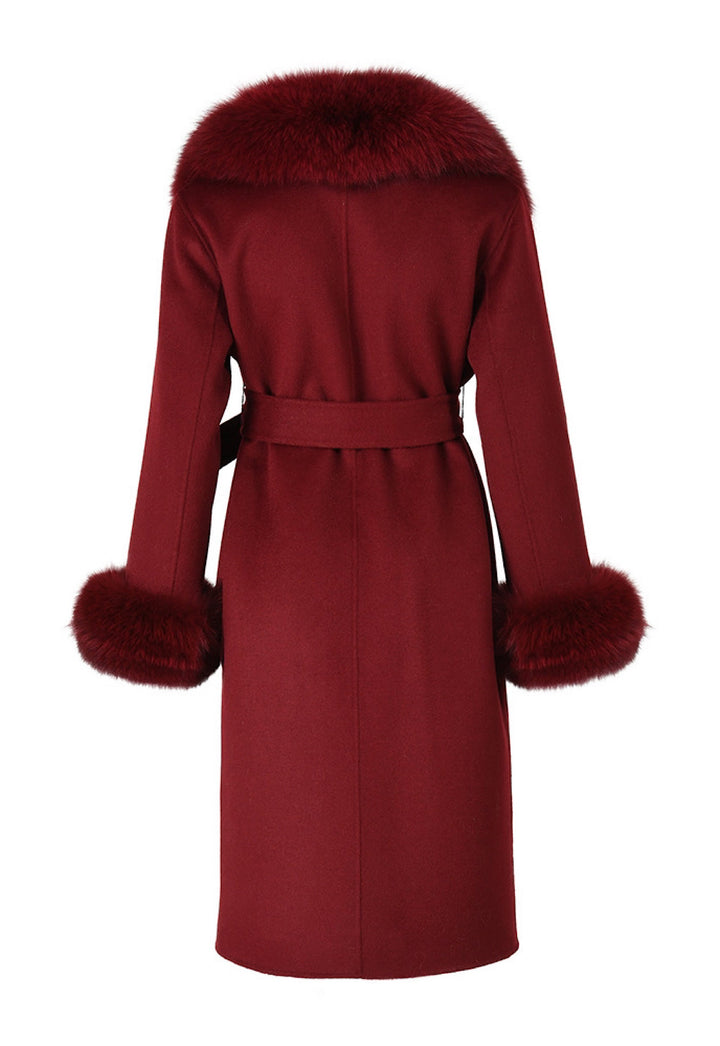 A burgundy classic coat with soft fox fur accents. The coat’s sleek silhouette and plush fur details create a chic and elegant statement for colder seasons.